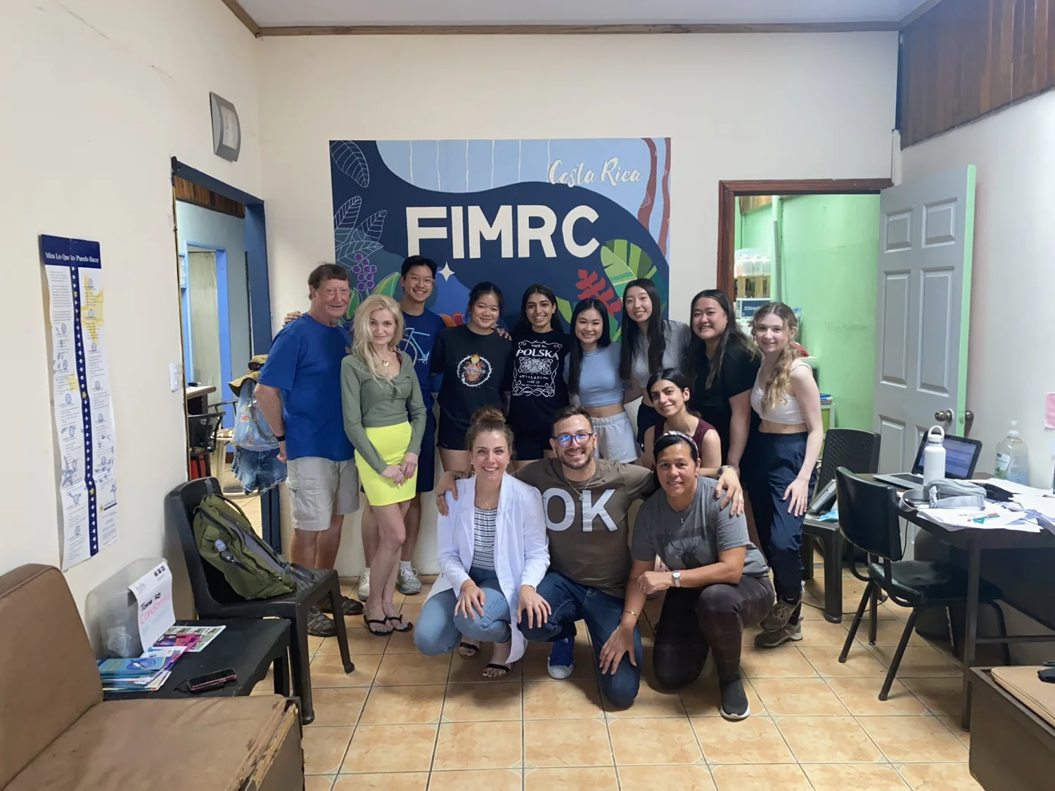 FIMRC team and community members gathered inside a clinic in Costa Rica