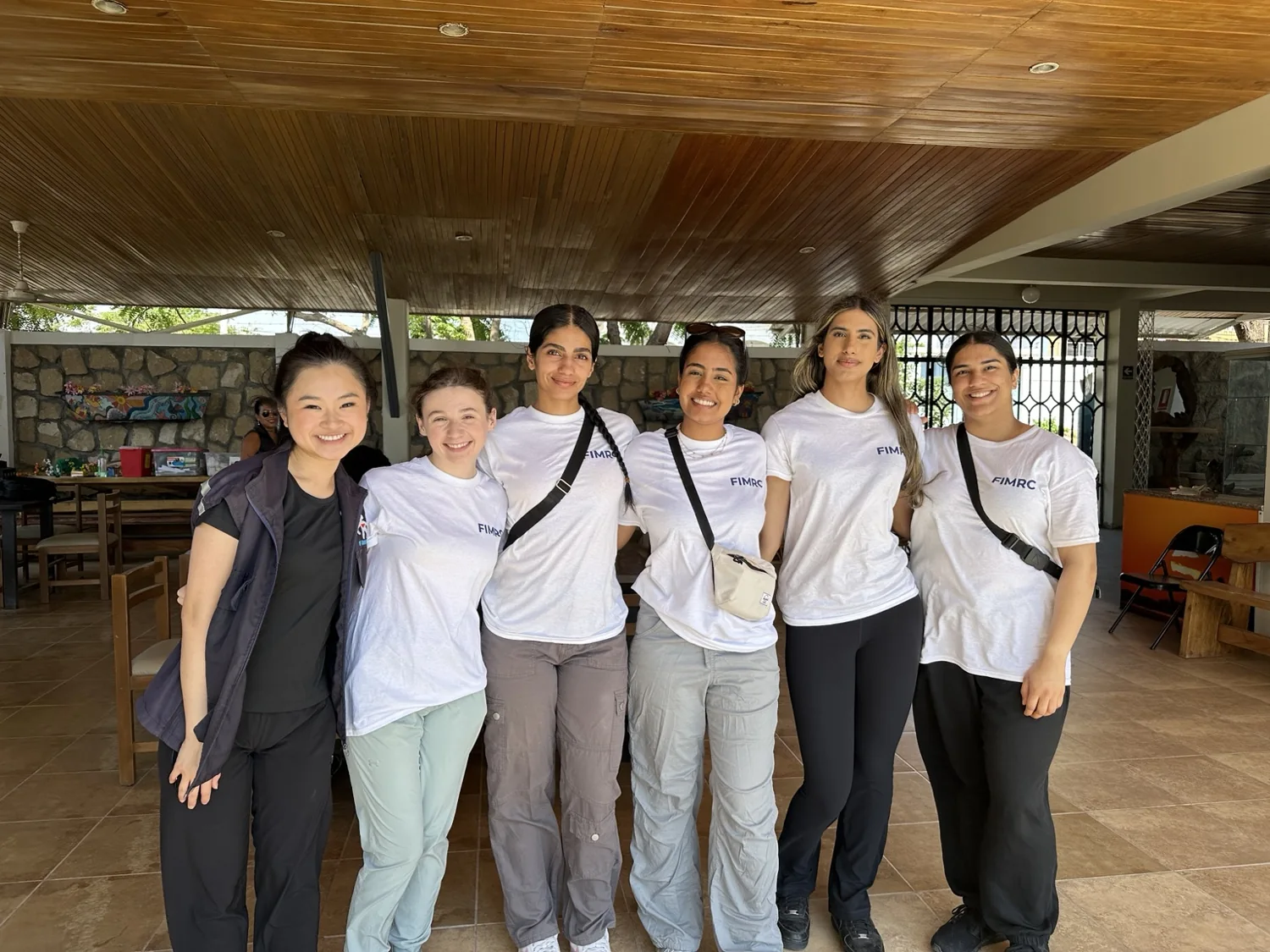 FIMRC volunteers posing together at a group gathering